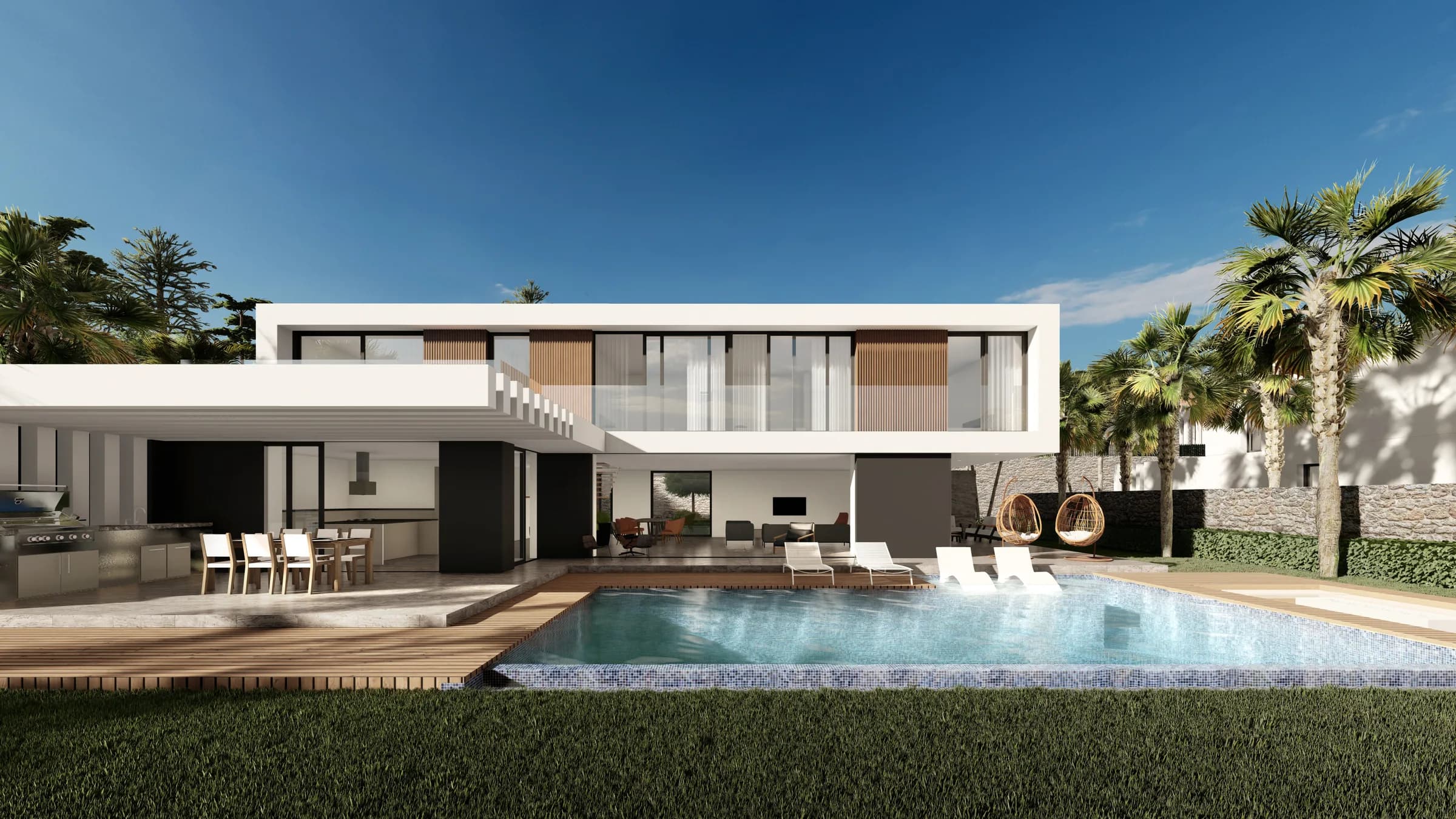 Garden side of a villa with pool and outdoor kitchen