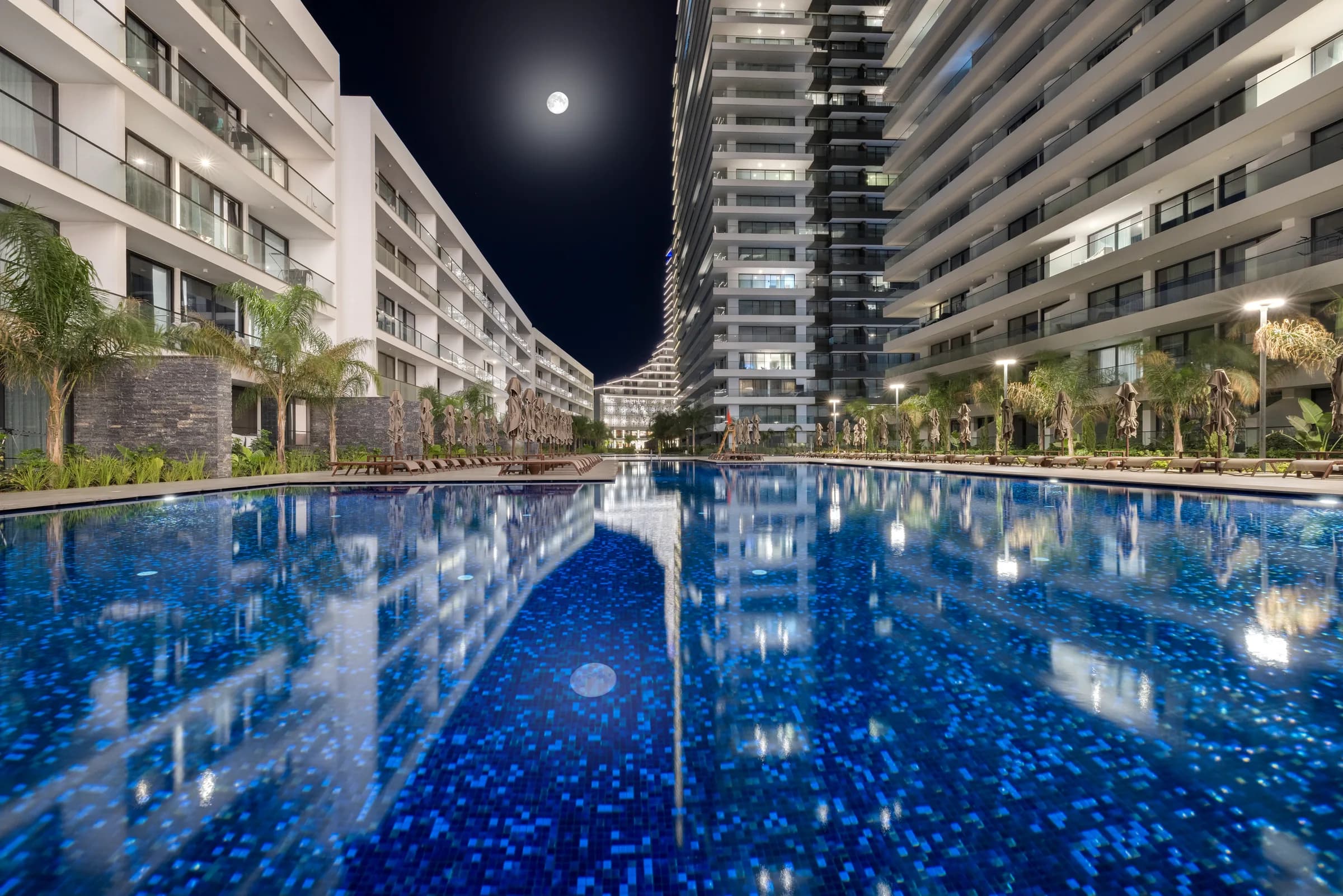 Pool between the buildings at night