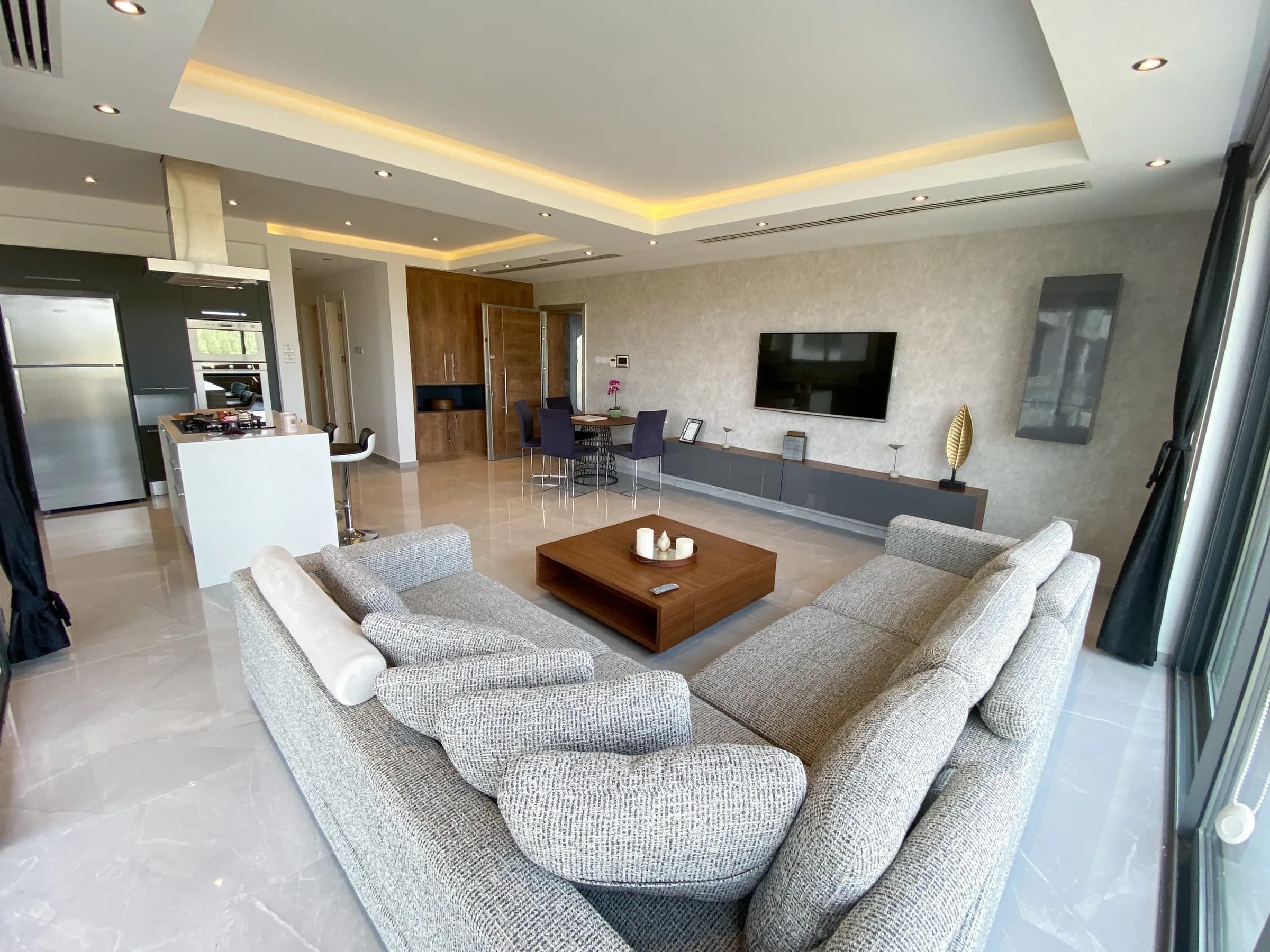 Living area with the kitchen behind it (photo)