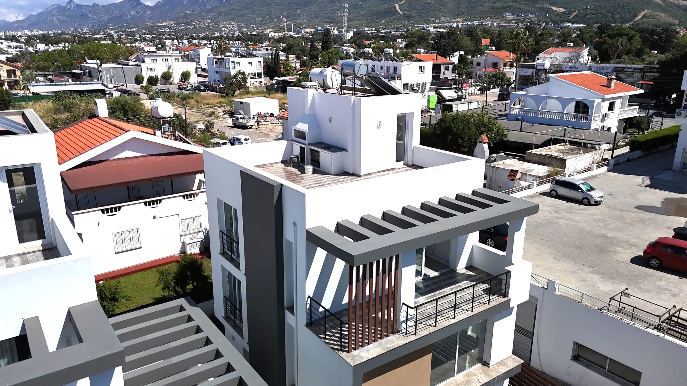 Corner villa with terraces and roof pergola