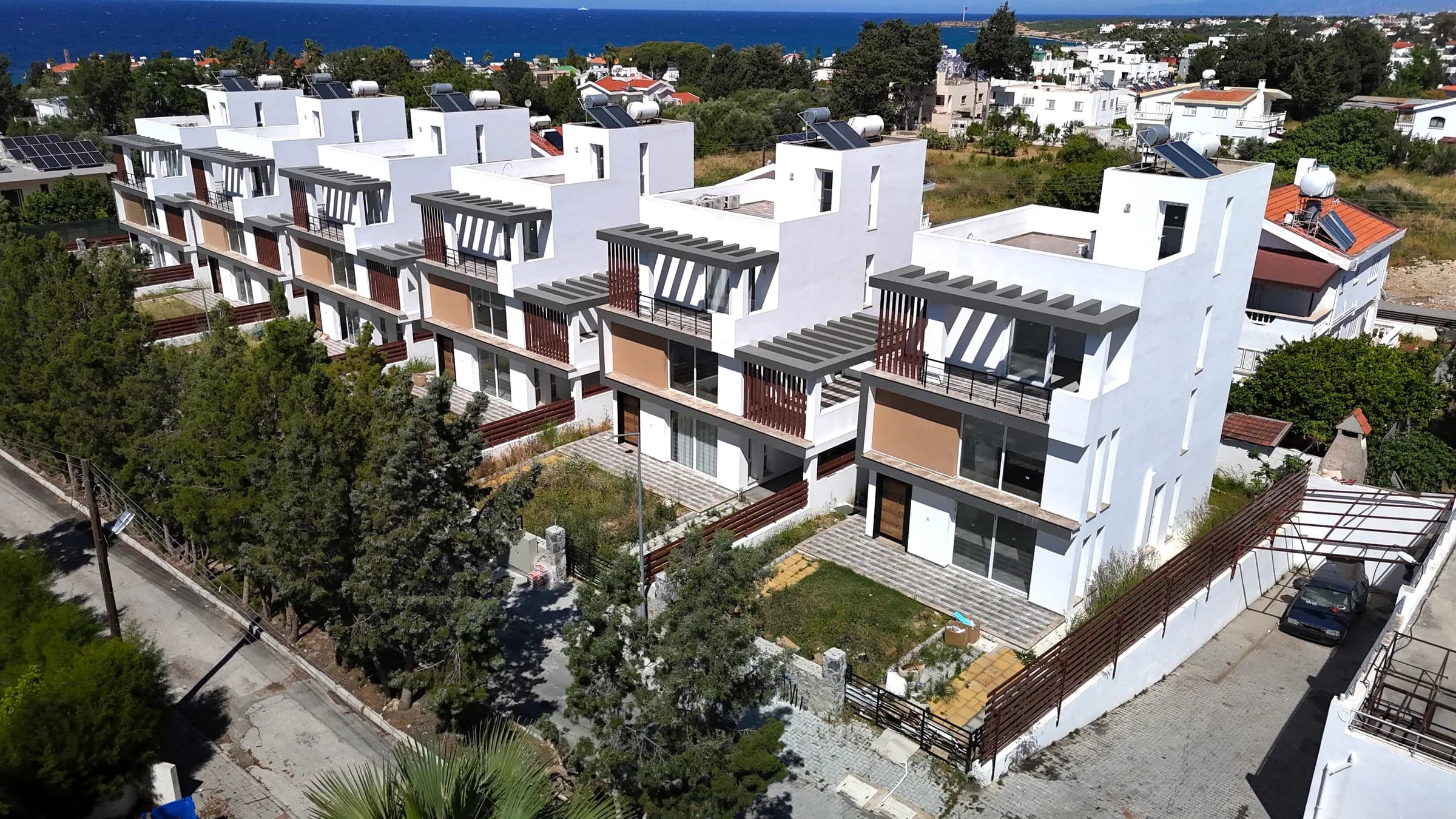 Street side of the six villas, May 2024
